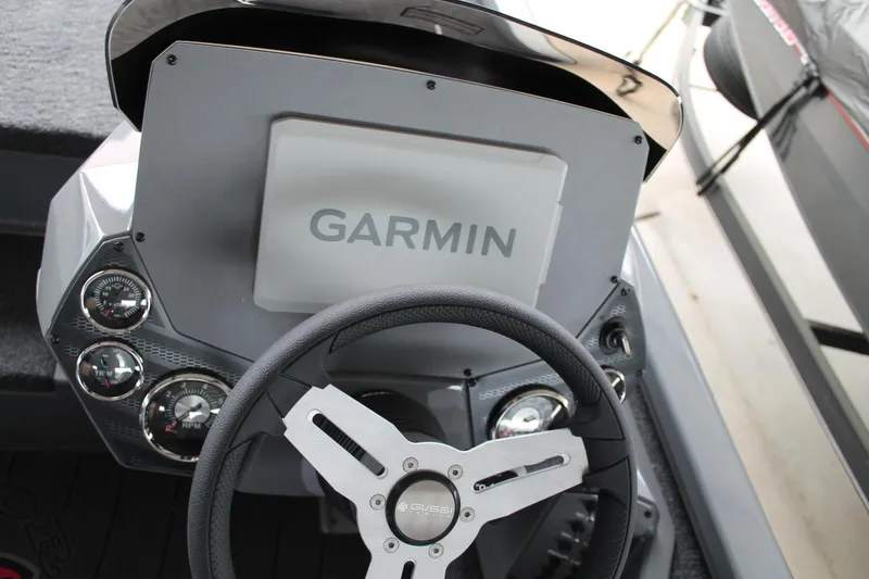 Slide: The Image of 2025 Vexus AVX2080 boat dashboard with Garmin display and steering wheel. - 12