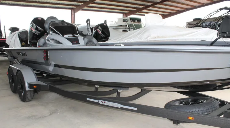 Slide: The Image of 2025 Vexus AVX2080 boat in a covered storage area, showcasing sleek design and modern features. - 16