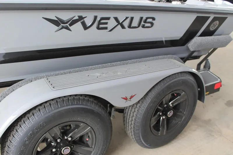 Slide: The Image of 2025 Vexus AVX2080 boat trailer with black wheels and sleek design. - 18