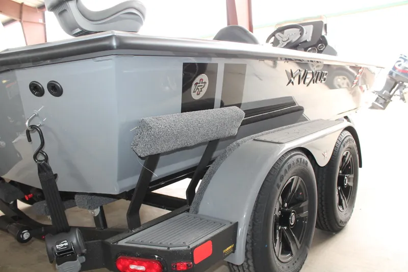 Slide: The Image of 2025 Vexus AVX2080 boat on trailer, featuring sleek design and modern features. - 2