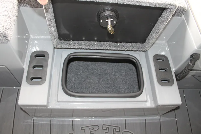 Slide: The Image of 2025 Vexus AVX2080 boat storage compartment with secure lock and carpeted interior. - 21