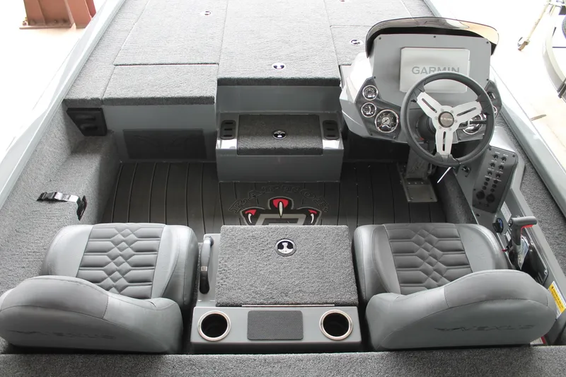 Slide: The Image of 2025 Vexus AVX2080 boat interior with steering wheel, seats, and Garmin display. - 4