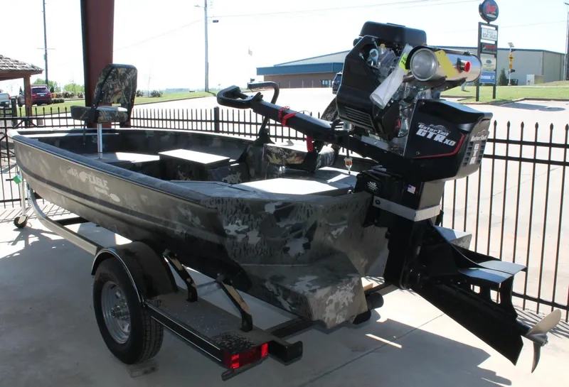 Slide: The Image of 2025 War Eagle 750 Gladiator boat with camouflage design and powerful outboard motor. - 11