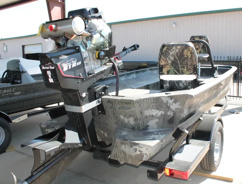 Slide: The Image of 2025 War Eagle 750 Gladiator boat with camo seats and powerful Gator Tail motor. - 13