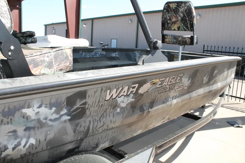 Slide: The Image of 2025 War Eagle 750 Gladiator boat with camouflage design and logo. - 14