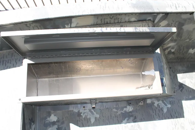 Slide: The Image of Open storage compartment in 2025 War Eagle 750 Gladiator boat, featuring a spacious interior. - 16