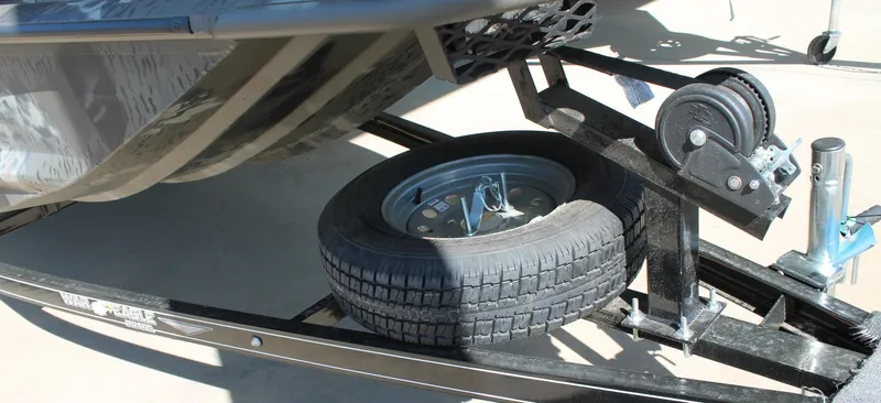 Slide: The Image of Trailer with spare tire for 2025 War Eagle 750 Gladiator boat. - 2