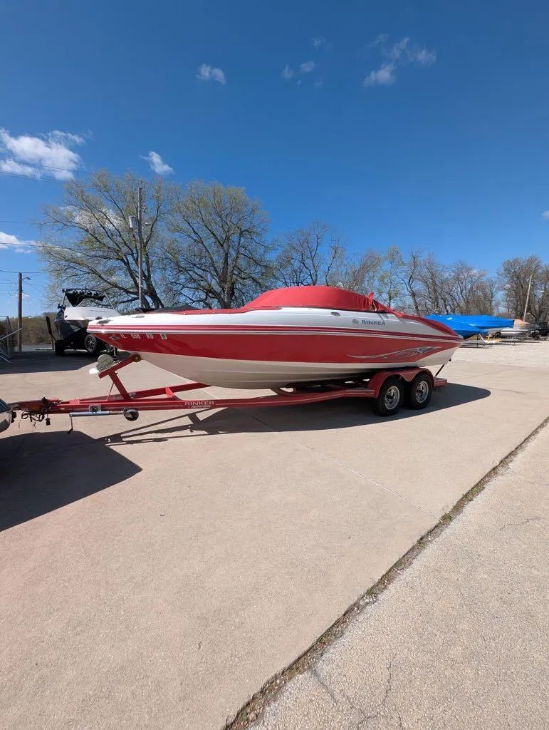 Slide: The Image of 2006 Rinker Captiva 226 boat on trailer under clear blue sky. - 1