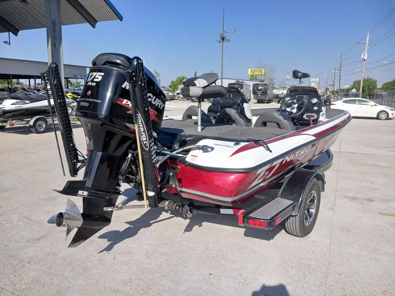 Slide: The Image of 2015 Nitro Z7 boat with Mercury 175 Pro XS engine in a parking lot. - 10