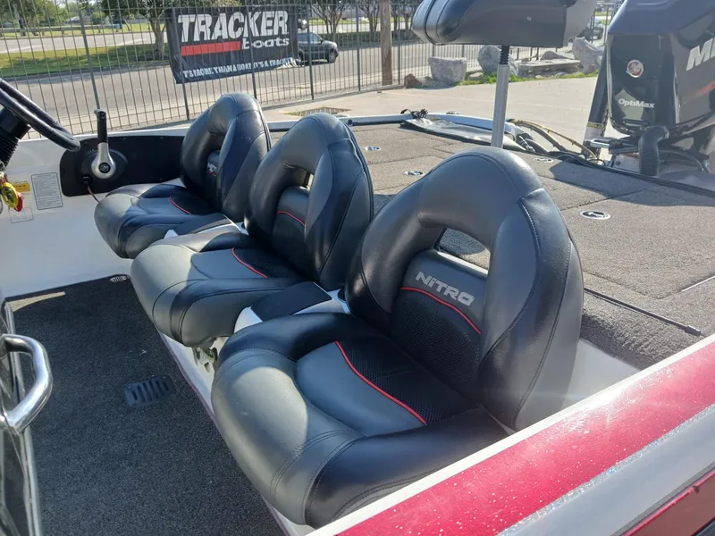 Slide: The Image of 2015 Nitro Z7 boat interior with black leather seats and steering wheel. - 14