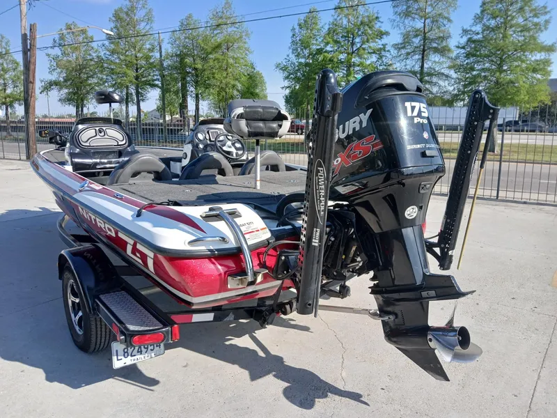 Slide: The Image of 2015 Nitro Z7 boat with Mercury 175 Pro XS engine, parked outdoors. - 2