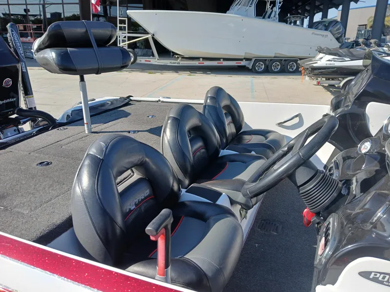 Slide: The Image of Interior of a 2015 Nitro Z7 boat with black leather seats and steering wheel. - 6