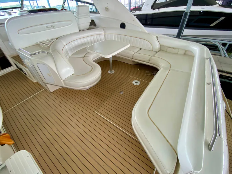 Slide: The Image of Luxurious 1996 Sea Ray 450 Sundancer yacht with spacious seating and elegant interior design. - 10