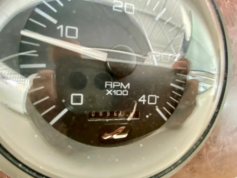 Slide: The Image of Close-up of a 1996 Sea Ray 450 Sundancer RPM gauge showing 896.5 hours. - 14