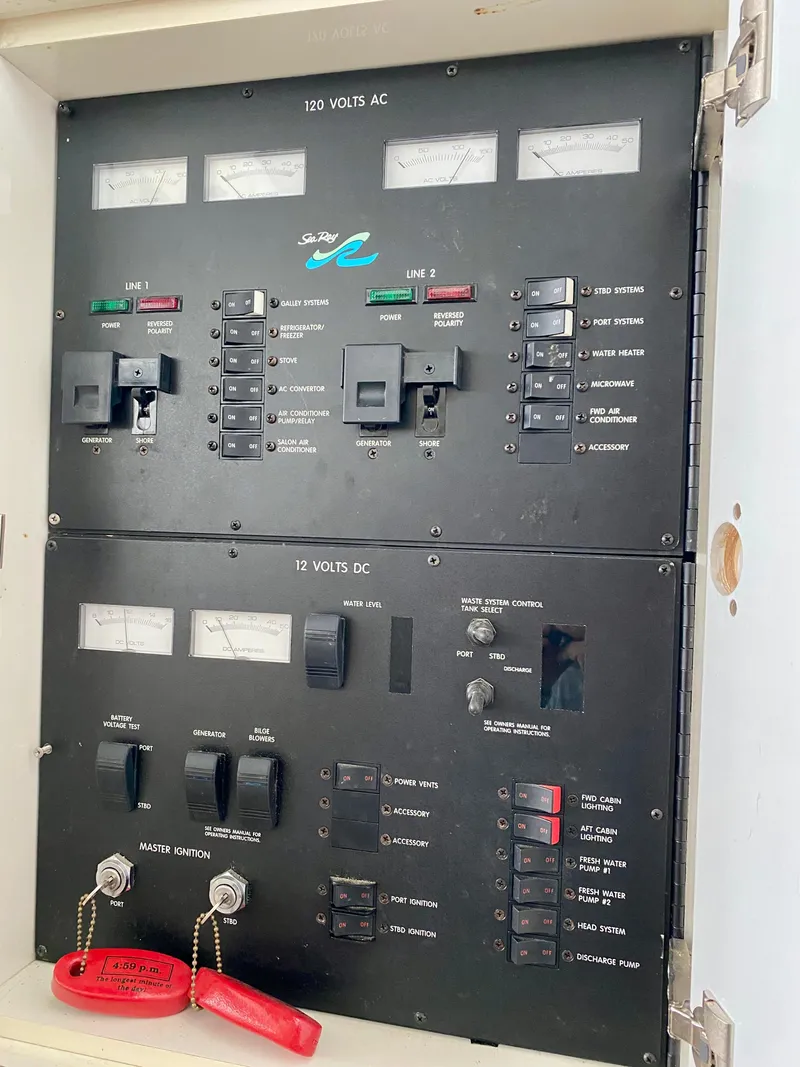 Slide: The Image of Electrical control panel of a 1996 Sea Ray 450 Sundancer boat. - 29