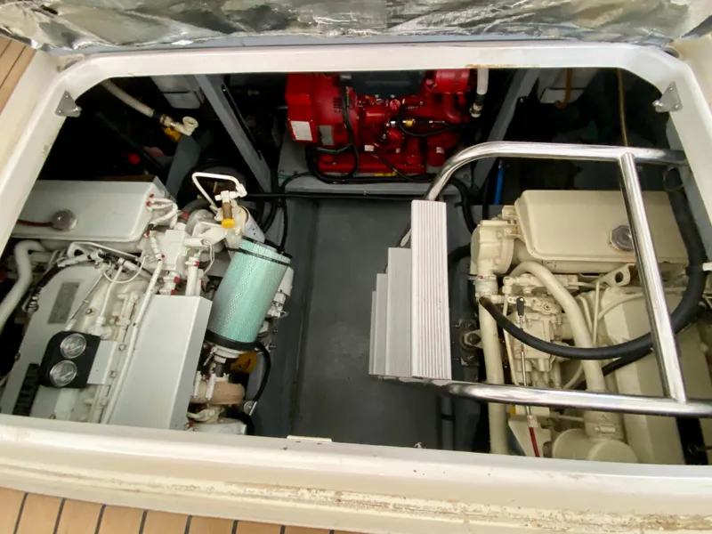 Slide: The Image of Engine compartment of 1996 Sea Ray 450 Sundancer, showcasing dual engines and mechanical components. - 30