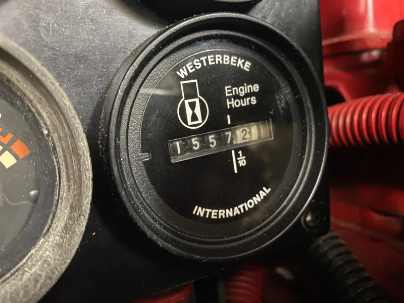 Slide: The Image of Westerbeke engine hour meter showing 1557.2 hours on a 1996 Sea Ray 450 Sundancer. - 32