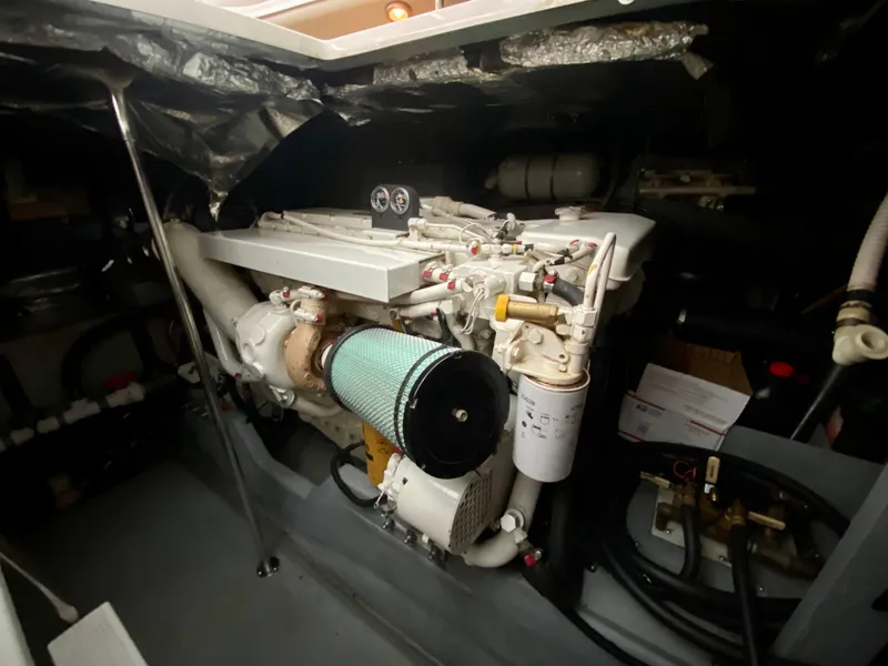 Slide: The Image of Engine room of 1996 Sea Ray 450 Sundancer yacht, showcasing detailed mechanical components. - 33
