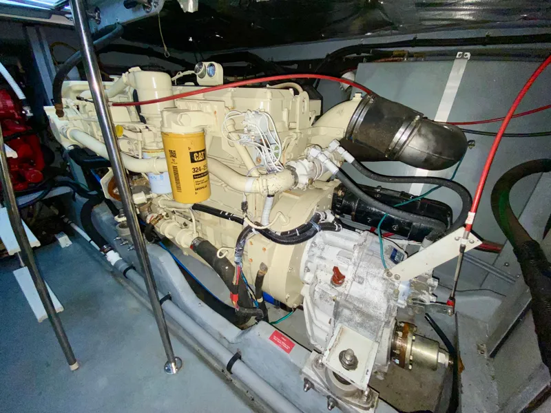 Slide: The Image of Engine room of 1996 Sea Ray 450 Sundancer with visible components and wiring. - 34