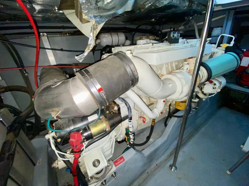 Slide: The Image of Engine room of a 1996 Sea Ray 450 Sundancer boat, showcasing mechanical components. - 35