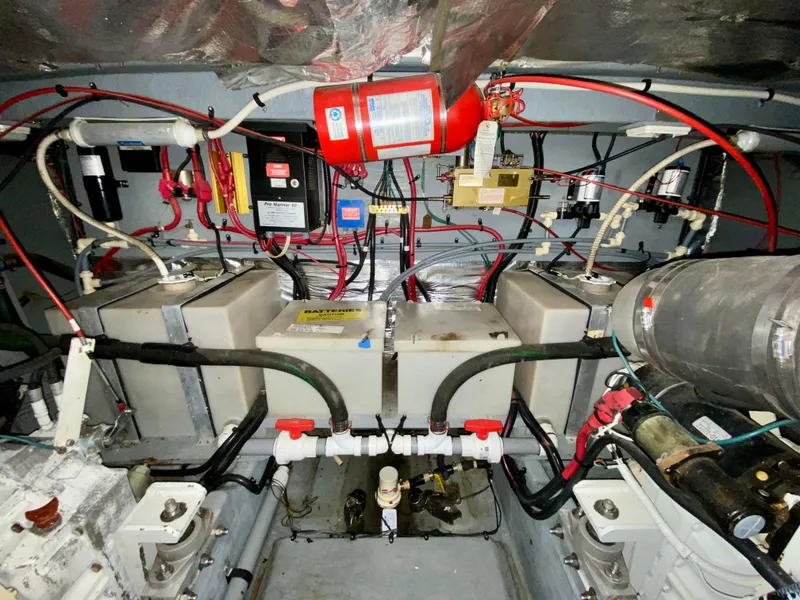 Slide: The Image of Engine room of 1996 Sea Ray 450 Sundancer with batteries and wiring. - 37