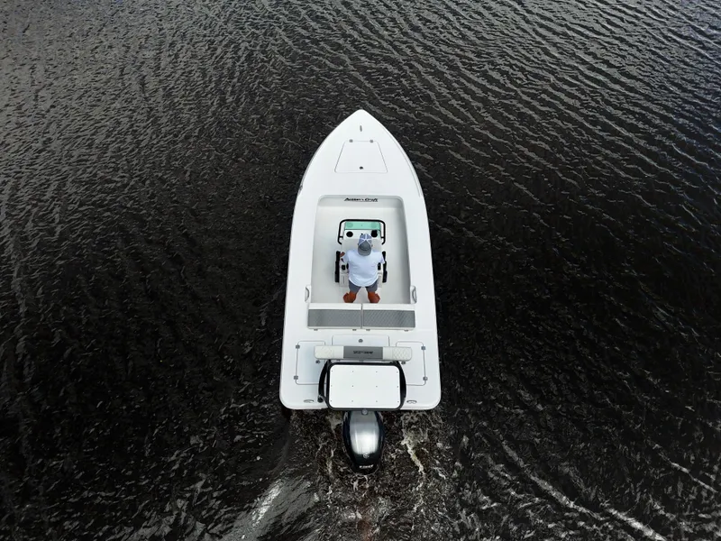 Slide: The Image of Overhead view of 2025 Action Craft 17 Flats boat navigating dark waters. - 22