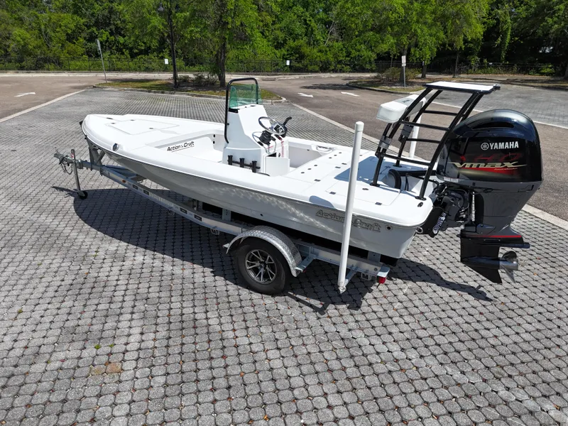 Slide: The Image of 2025 Action Craft 17 Flats boat with Yamaha VMAX engine on a trailer. - 27