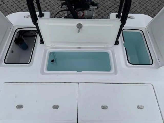 Slide: The Image of 2025 Action Craft 17 Flats boat storage compartments and livewell, open and ready for use. - 50