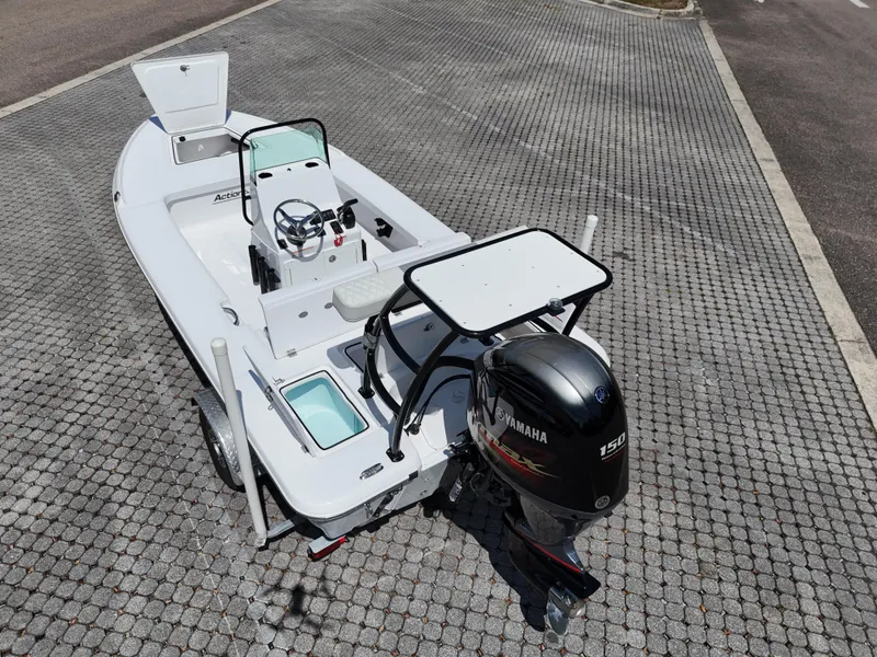 Slide: The Image of 2025 Action Craft 17 Flats boat with Yamaha outboard motor on a paved surface. - 60