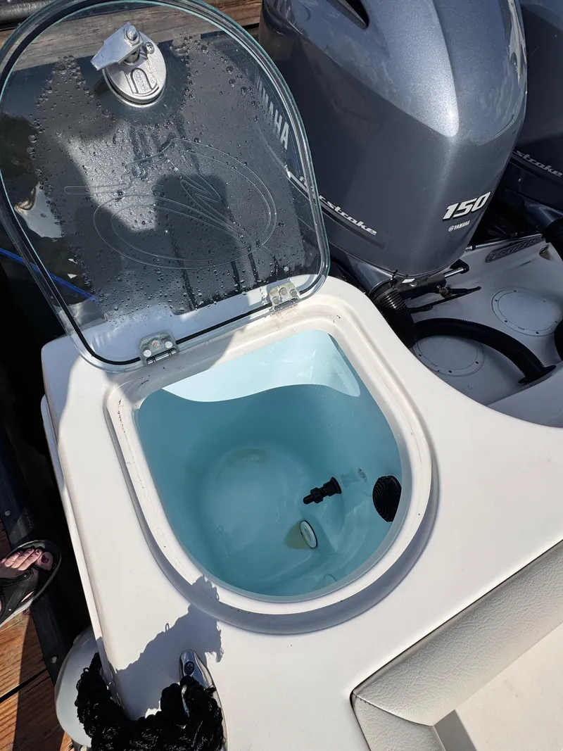 Slide: The Image of Livewell on 2023 Sailfish 242 CC boat with Yamaha outboard engine. - 3