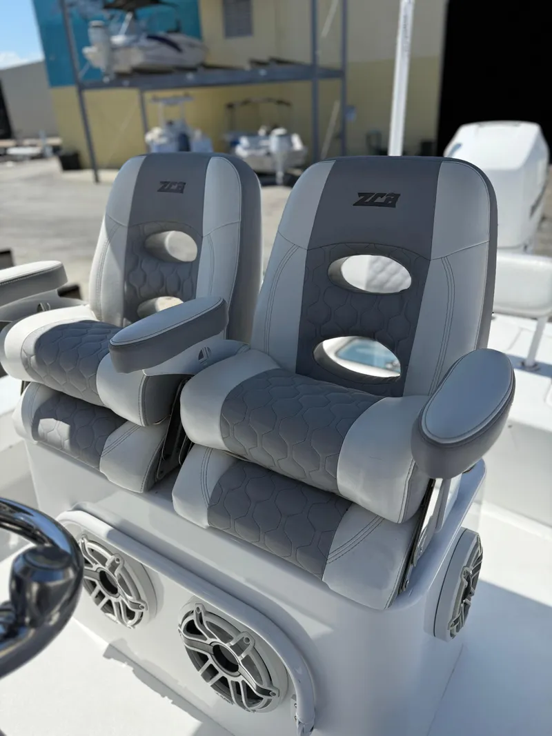 Slide: The Image of Luxury seating on 2022 ZCB 26 Freemason boat, featuring dual gray cushioned seats. - 2