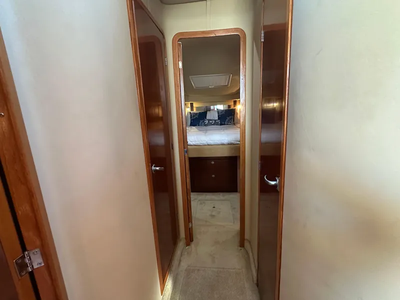 Slide: The Image of Hallway leading to bedroom in 2005 Sea Ray 420 Sedan Bridge yacht. - 18