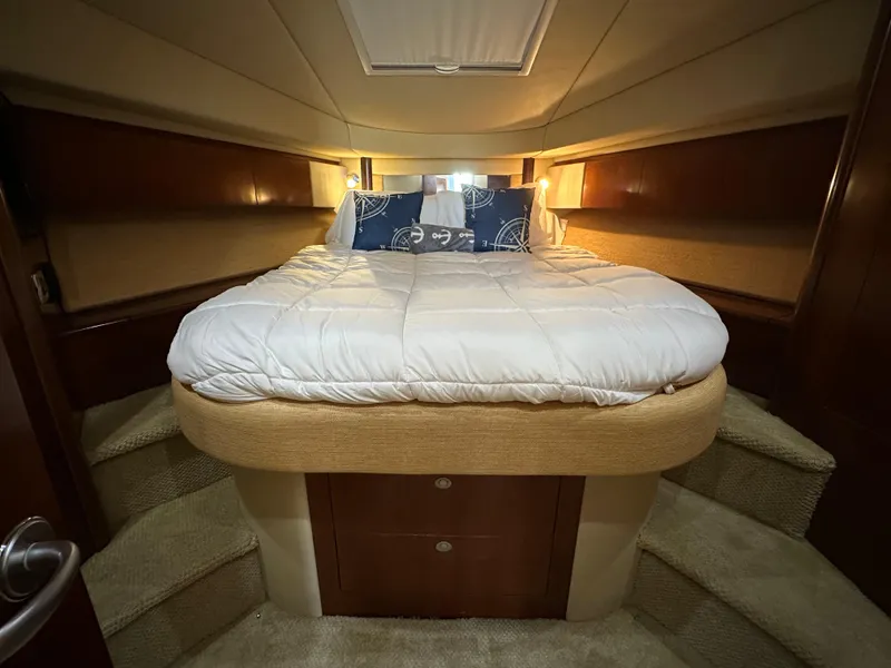 Slide: The Image of Luxurious bedroom interior of 2005 Sea Ray 420 Sedan Bridge yacht. - 21