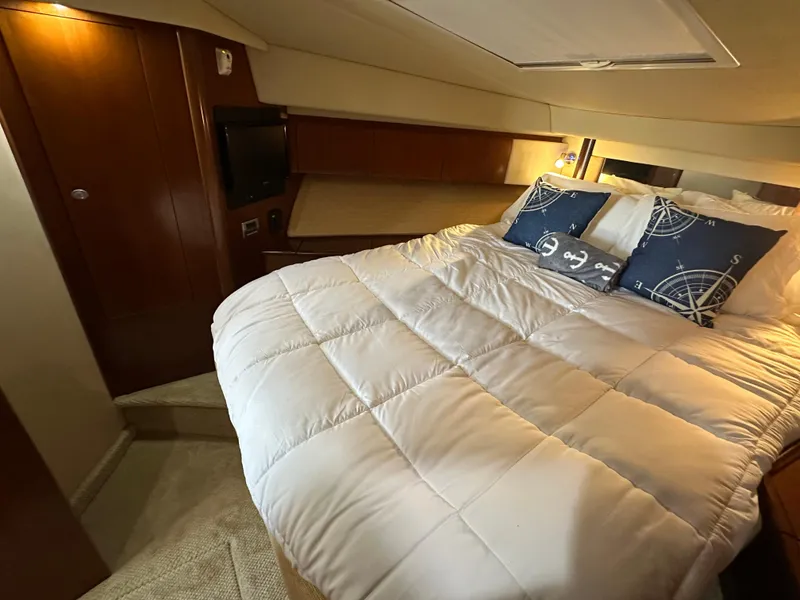 Slide: The Image of Luxurious bedroom interior of 2005 Sea Ray 420 Sedan Bridge yacht. - 22