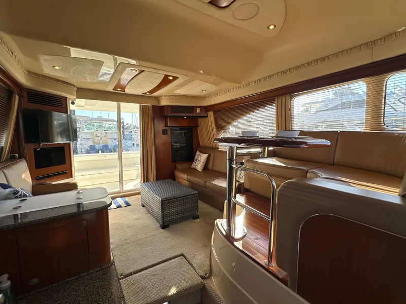 Slide: The Image of Luxurious interior of 2005 Sea Ray 420 Sedan Bridge yacht with elegant seating and modern amenities. - 26