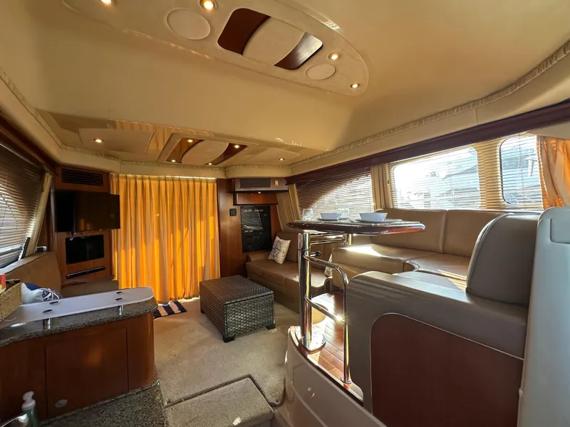 Slide: The Image of Luxurious interior of 2005 Sea Ray 420 Sedan Bridge yacht with elegant seating and modern amenities. - 27