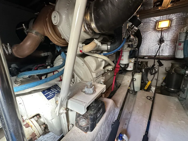 Slide: The Image of Engine room of 2005 Sea Ray 420 Sedan Bridge, showcasing mechanical components and wiring. - 32