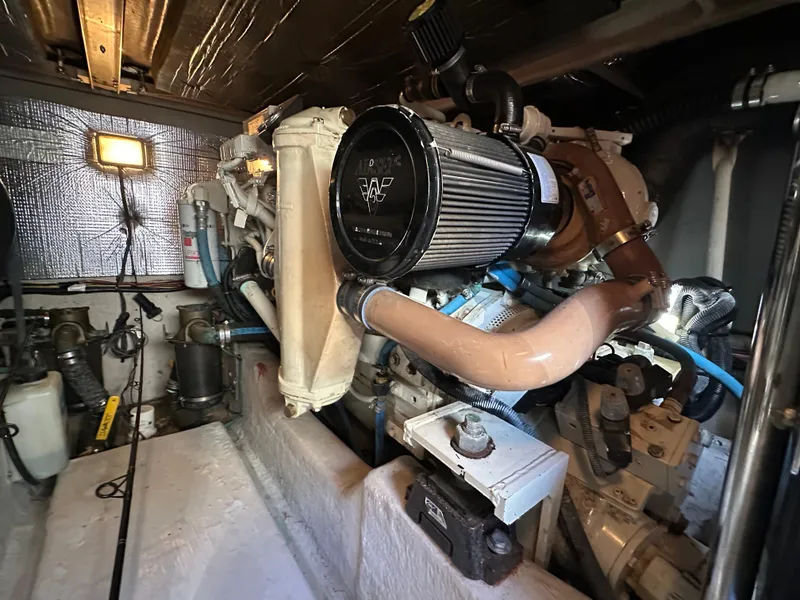 Slide: The Image of Engine room of 2005 Sea Ray 420 Sedan Bridge, showcasing mechanical components and systems. - 33