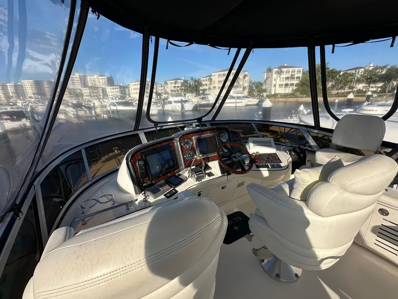 Slide: The Image of Interior view of 2005 Sea Ray 420 Sedan Bridge yacht cockpit with modern navigation equipment. - 7