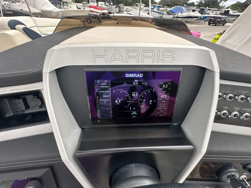 Slide: The Image of Dashboard of 2022 Harris Crowne SL 250 boat with Simrad display. - 23