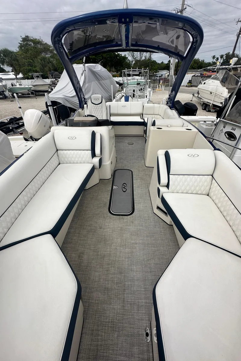 Slide: The Image of 2022 Harris Crowne SL 250 pontoon boat with spacious seating and modern design. - 41