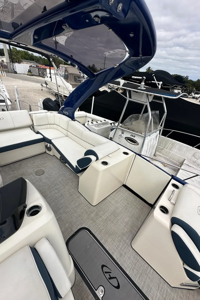 Slide: The Image of 2022 Harris Crowne SL 250 boat interior with luxurious seating and modern design. - 49
