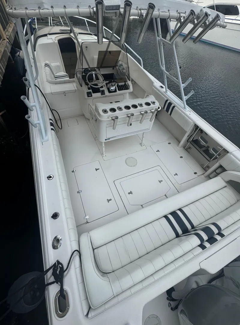 Slide: The Image of 2000 Intrepid 366 boat with spacious deck and fishing rod holders. - 3