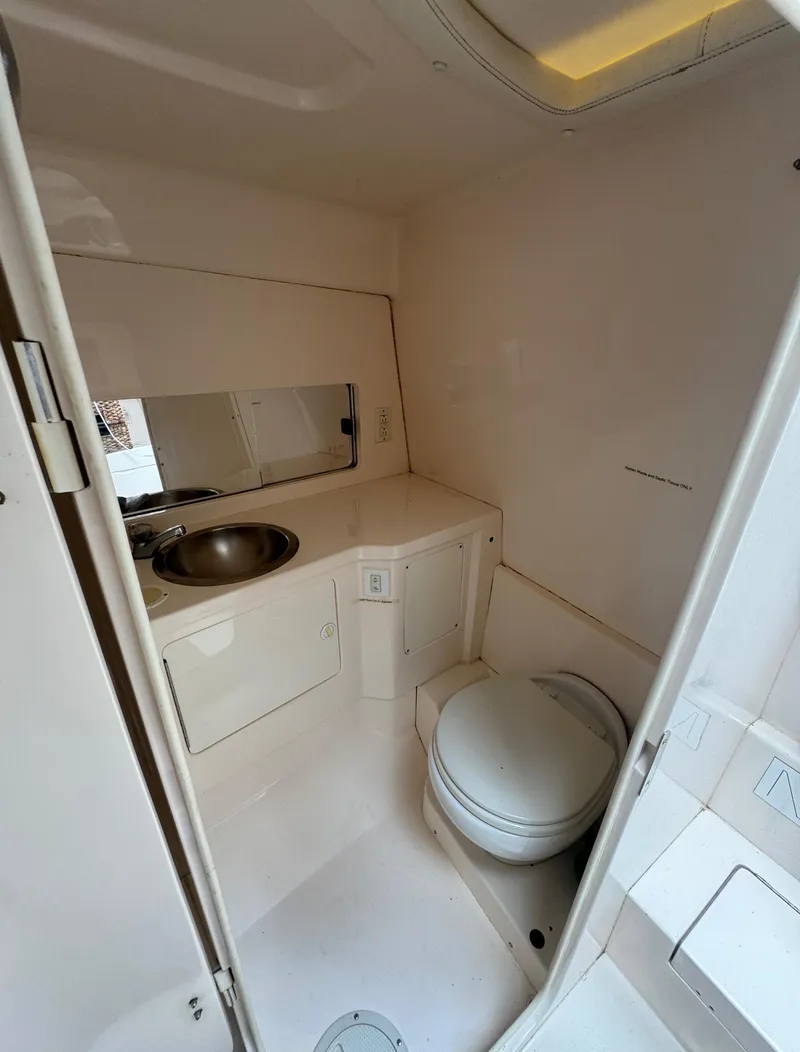 Slide: The Image of 2000 Intrepid 366 boat bathroom with sink and toilet. - 30