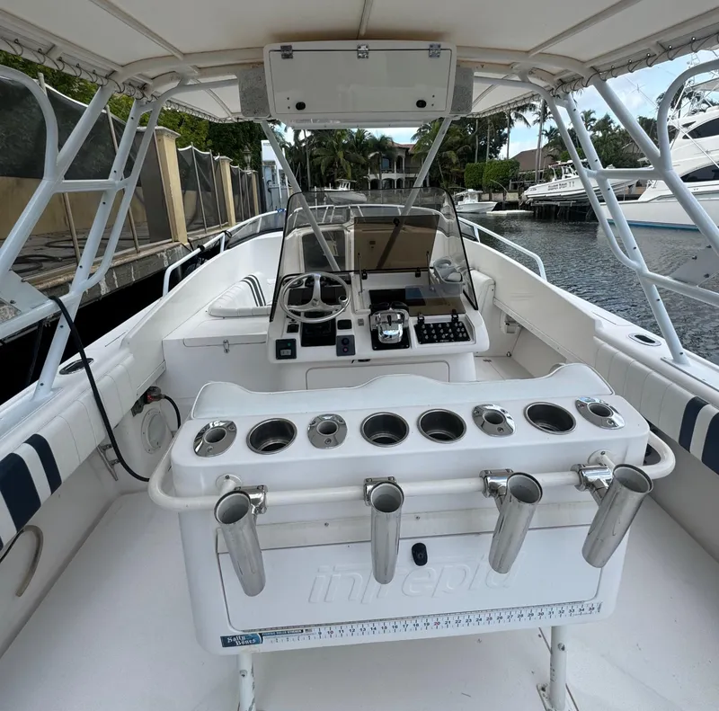 Slide: The Image of Cockpit view of a 2000 Intrepid 366 boat with fishing rod holders. - 9