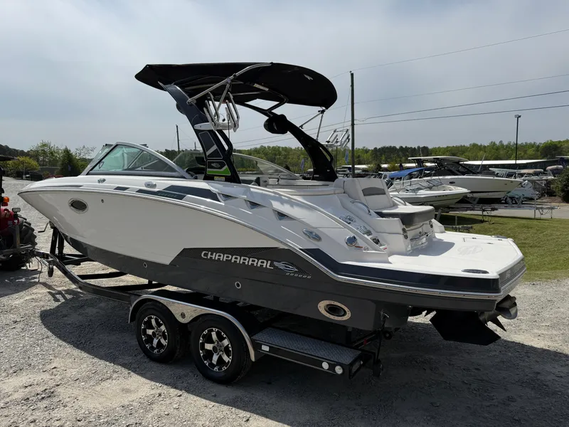 Slide: The Image of 2016 Chaparral 244 boat on trailer, parked outdoors, side view. - 3
