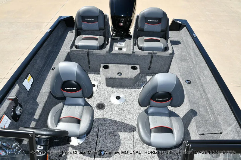 Slide: The Image of 2025 Tracker Pro Guide V-175 Combo boat interior with four gray seats and carpeted flooring. - 10