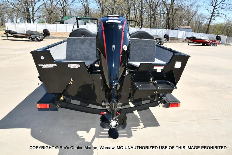 Slide: The Image of 2025 Tracker Pro Guide V-175 Combo boat, rear view, parked outdoors on concrete. - 18