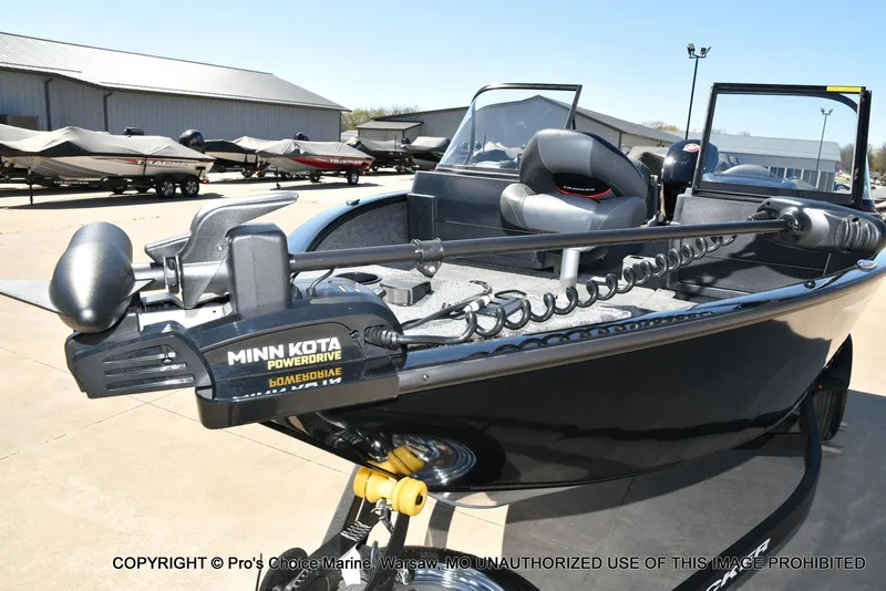 Slide: The Image of 2025 Tracker Pro Guide V-175 Combo boat with Minn Kota PowerDrive motor, displayed outdoors. - 24