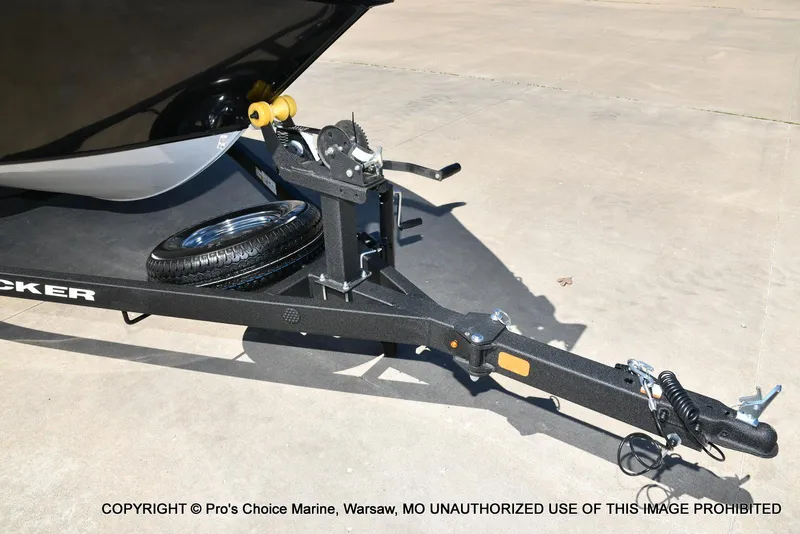 Slide: The Image of Trailer hitch of 2025 Tracker Pro Guide V-175 Combo with spare tire on concrete. - 27